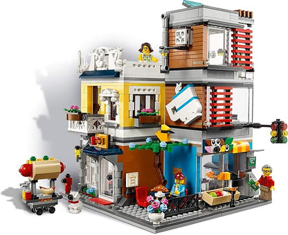LEGO Creator 3 in 1 Townhouse Pet Shop &amp Café 31097 Toy Store Building Set with Bank Town Playset with a Toy Tram Animal Figures and Minifigures (969 Pieces)